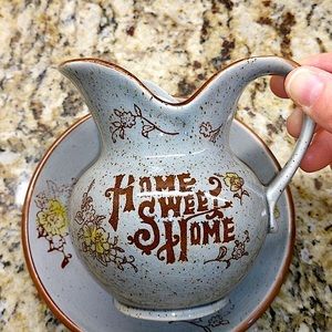 Vintage ceramic pitcher and saucer.  Gray w/ brown trim & light golden accents.